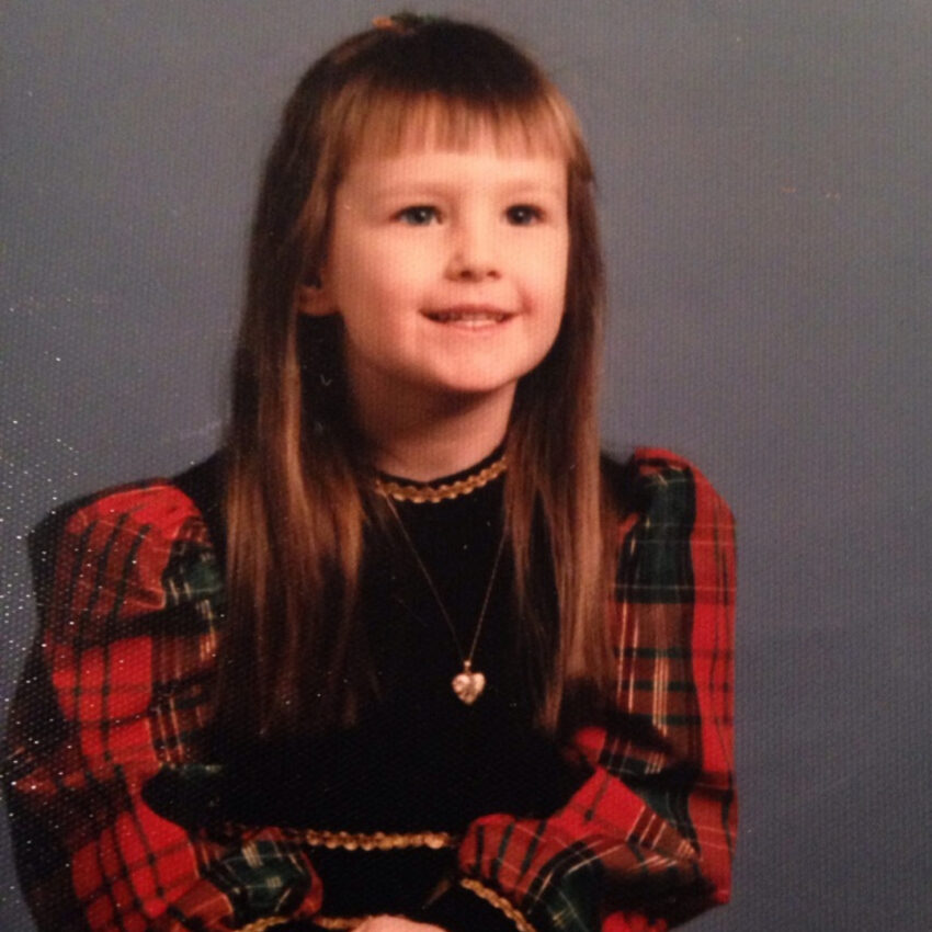 Rebecca Crets posing for a holiday photo as a kid